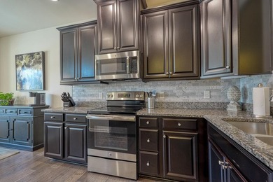 Enjoy low-maintenance living in the highly desirable River Falls - photo 12