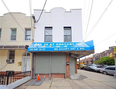 Presenting a well-maintained corner mixed-use building situated - photo 3