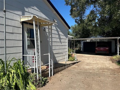Step into this quaint and inviting home featuring original wood