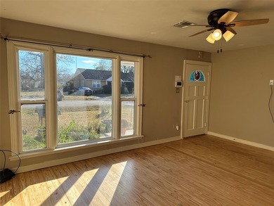 Step into this quaint and inviting home featuring original wood