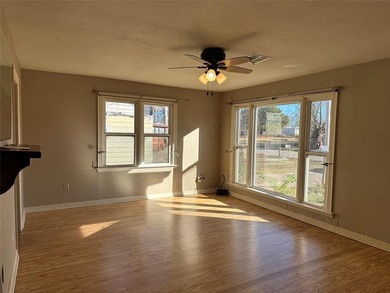 Step into this quaint and inviting home featuring original wood