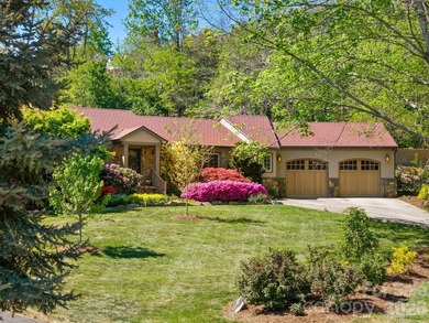 Tucked away among beautiful blooming perennials in Asheville's - photo 3