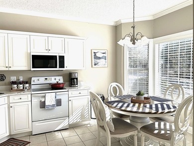 NO STAIRS in this one level, ground floor, end-unit condo