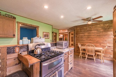 Set on nearly 2 private acres in Freedom, Maine, this unique - photo 15