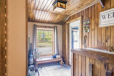 Set on nearly 2 private acres in Freedom, Maine, this unique - photo 25