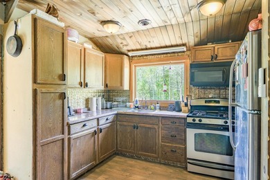 Set on nearly 2 private acres in Freedom, Maine, this unique - photo 29