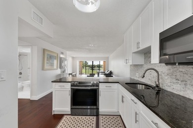 Wake up to tranquil lake and golf course views in this - photo 4