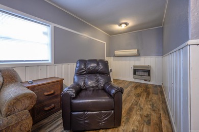 This quaint home sits in the perfect spot! Located just a short