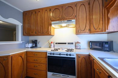 This quaint home sits in the perfect spot! Located just a short