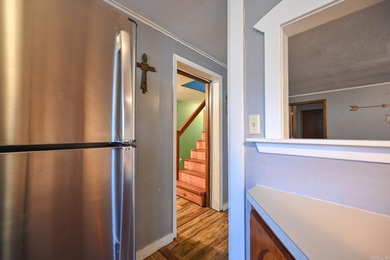 This quaint home sits in the perfect spot! Located just a short