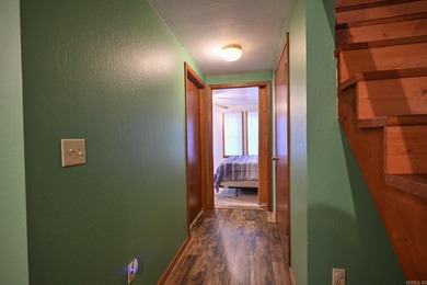 This quaint home sits in the perfect spot! Located just a short