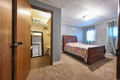 This quaint home sits in the perfect spot! Located just a short