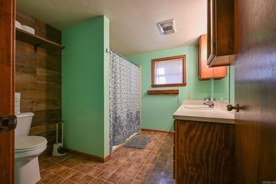 This quaint home sits in the perfect spot! Located just a short