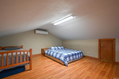 This quaint home sits in the perfect spot! Located just a short