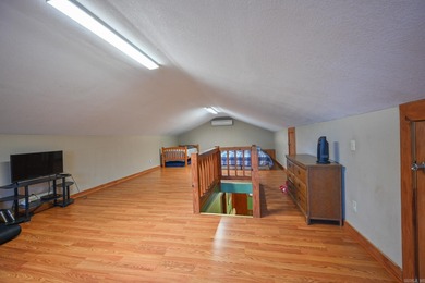 This quaint home sits in the perfect spot! Located just a short