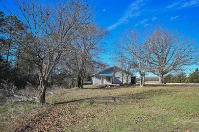 This quaint home sits in the perfect spot! Located just a short