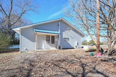 This quaint home sits in the perfect spot! Located just a short