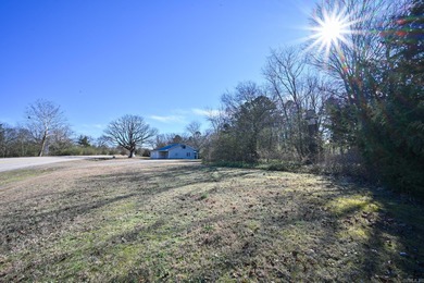 This quaint home sits in the perfect spot! Located just a short