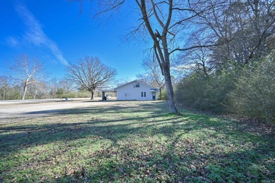 This quaint home sits in the perfect spot! Located just a short