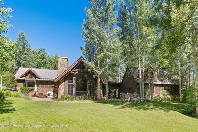 This classic mountain-style home features four bedrooms, each - photo 1