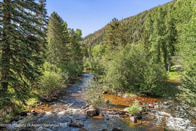 This classic mountain-style home features four bedrooms, each - photo 4