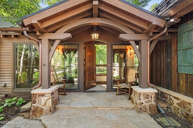 This classic mountain-style home features four bedrooms, each - photo 6