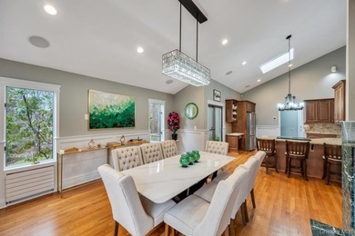 Tucked away on a beautifully landscaped 3/4-acre property, this - photo 12