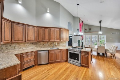 Tucked away on a beautifully landscaped 3/4-acre property, this - photo 13