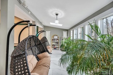 Tucked away on a beautifully landscaped 3/4-acre property, this - photo 17
