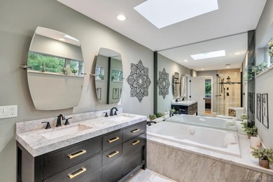 Tucked away on a beautifully landscaped 3/4-acre property, this - photo 21