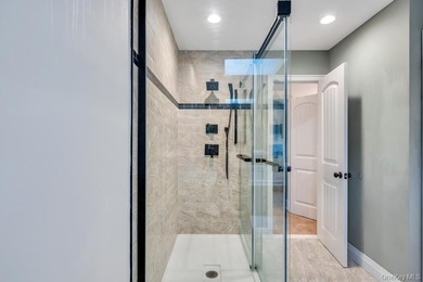 Tucked away on a beautifully landscaped 3/4-acre property, this - photo 22