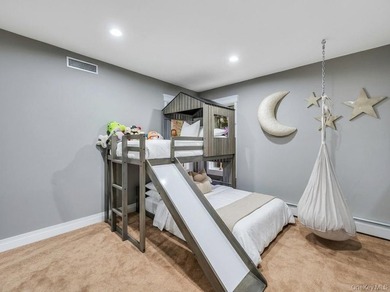 Tucked away on a beautifully landscaped 3/4-acre property, this - photo 23