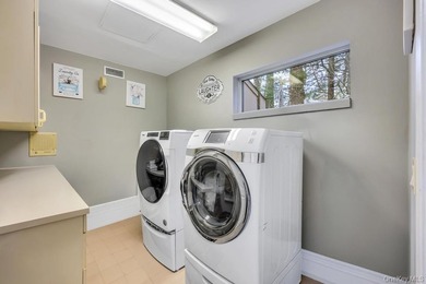 Tucked away on a beautifully landscaped 3/4-acre property, this - photo 27