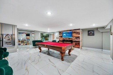 Tucked away on a beautifully landscaped 3/4-acre property, this - photo 31