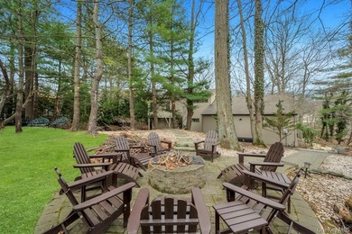 Tucked away on a beautifully landscaped 3/4-acre property, this - photo 40