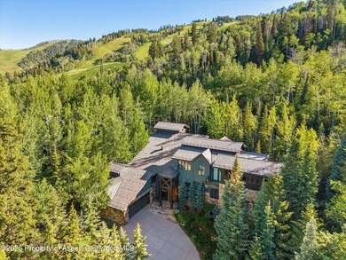 Located in the exclusive Maroon Creek Club, this timeless - photo 1