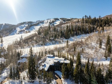 Located in the exclusive Maroon Creek Club, this timeless - photo 3