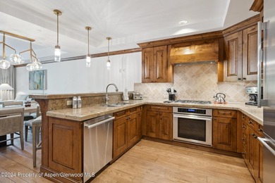 The Aspen Mountain Residences is nestled at the base of the - photo 4