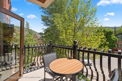 The Aspen Mountain Residences is nestled at the base of the - photo 8