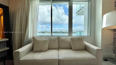 High-floor furnished studio with wide bay views. Part of the