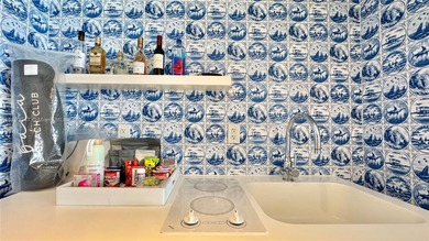 High-floor furnished studio with wide bay views. Part of the