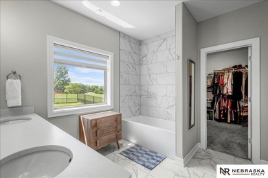 This custom 2023 ranch backs to the golf course AND has access - photo 22