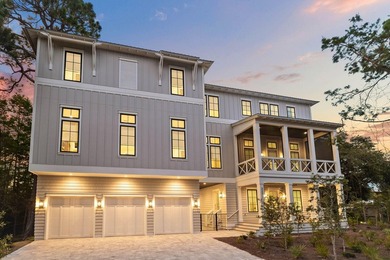 Completed in 2023, this stunning three-story beach house is - photo 1