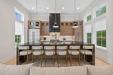 Completed in 2023, this stunning three-story beach house is - photo 4