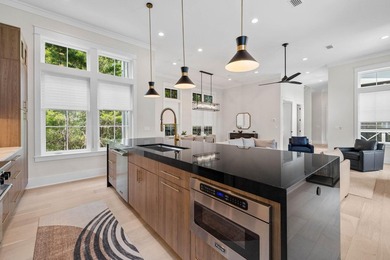 Completed in 2023, this stunning three-story beach house is - photo 5