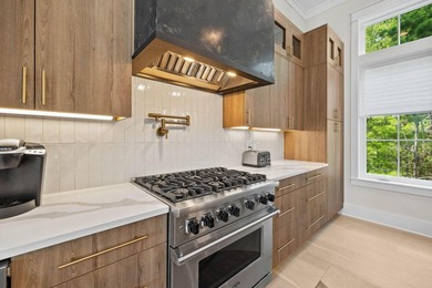 Completed in 2023, this stunning three-story beach house is - photo 6