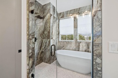 Completed in 2023, this stunning three-story beach house is - photo 8