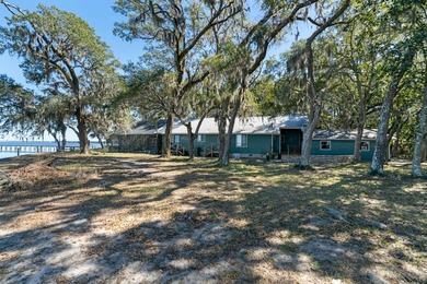 This amazing bay front home gives the feeling of being out in - photo 3