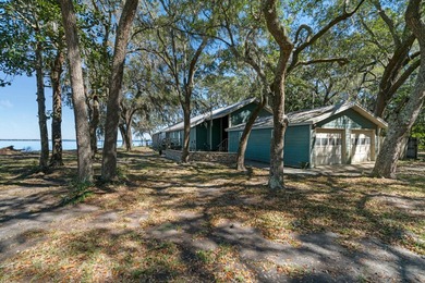 This amazing bay front home gives the feeling of being out in - photo 4