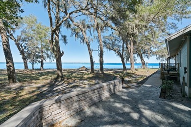 This amazing bay front home gives the feeling of being out in - photo 5